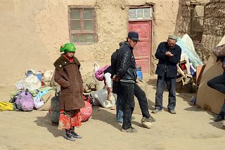 01 Waiting For The Camels In Yilik Village With Village Headman And His Family.jpg